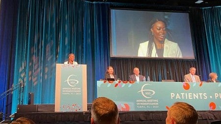 ann oluloro speaking at a medical conference